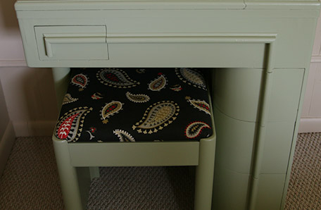 finished desk and reupholstered chair with paisley fabric