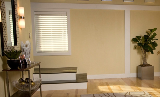 Window above steps on yellow colored walls