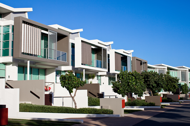 Small image of an exterior of a multi-family home properties next to each other.