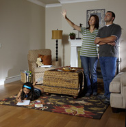 Couple in living room, getting ready to paint.