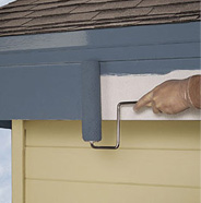 Roll paint onto fascia board.