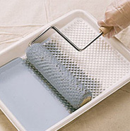 Load roller with paint.