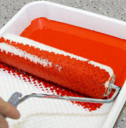 Load roller with paint.