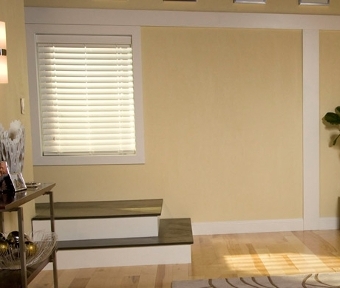 Window above steps on yellow colored walls