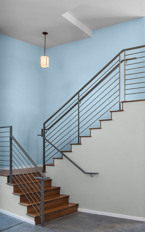 An office stairway with walls painted in a light soft blue color.
                After Rain M520-2
                