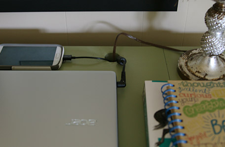 close up of finished desk with hole for device cords